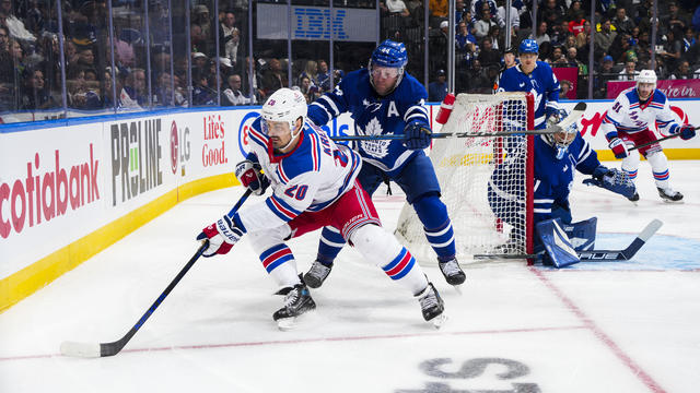 Chris Kreider #20 of the New York Rangers protects the puck against Morgan Rielly #44 of the Toronto Maple Leafs during the second period at the Scotiabank Arena on October 19, 2024 in Toronto, Ontario, Canada. 