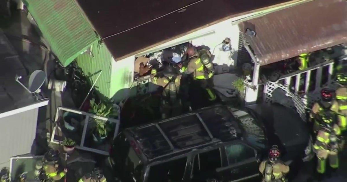 Woman injured, dog dies in NW Miami-Dade mobile home fire