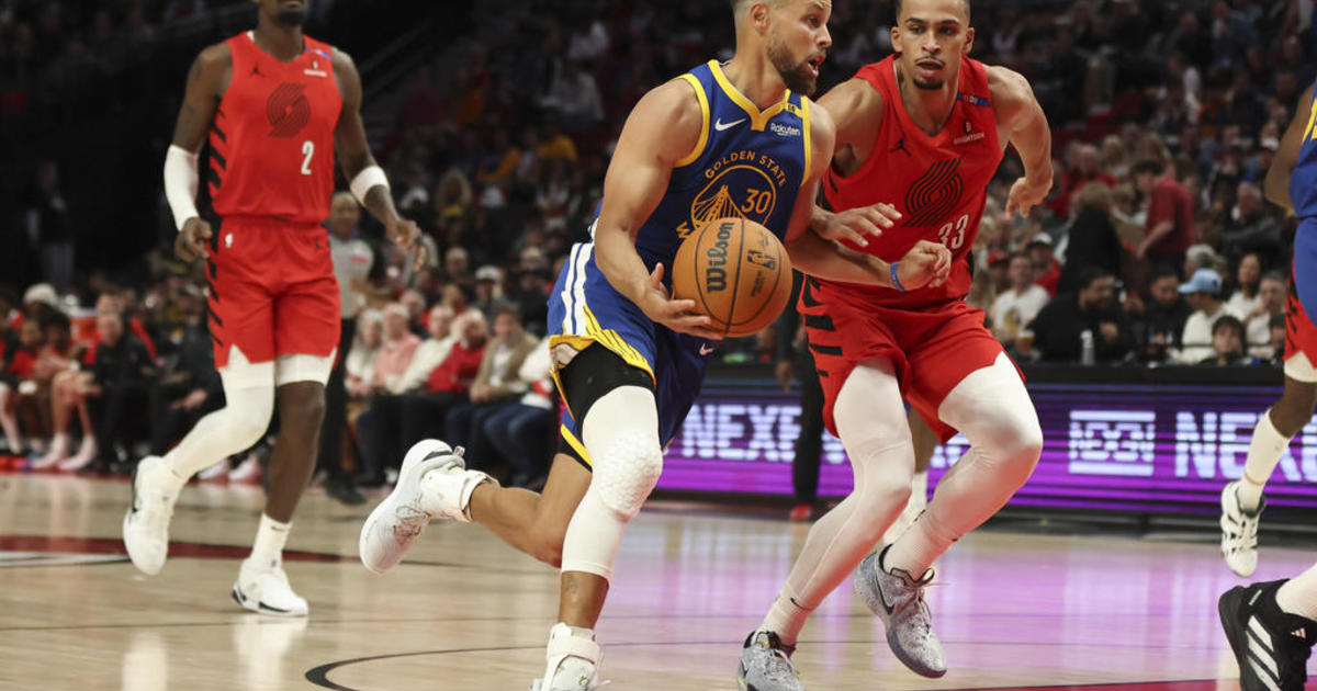 Curry leads the Golden State Warriors in their season-opening loss to the Portland Trail Blazers, 139-104