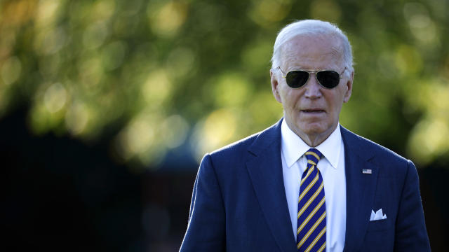 President Biden talks briefly with reporters as he departs the White House on Oct. 24, 2024, in Washington. 