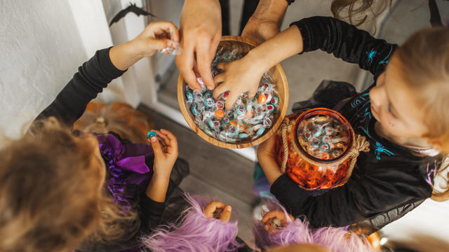 Trick or Treat tradition on Halloween. Kids asking for sweets and candies. 