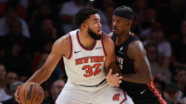 Jimmy Butler #22 of the Miami Heat defends against Karl-Anthony Towns #32 of the New York Knicks during the second half at Kaseya Center on October 30, 2024 in Miami, Florida. 