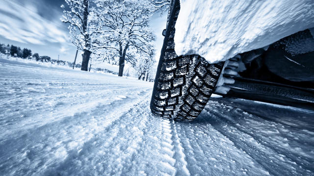 Car tires on winter road 