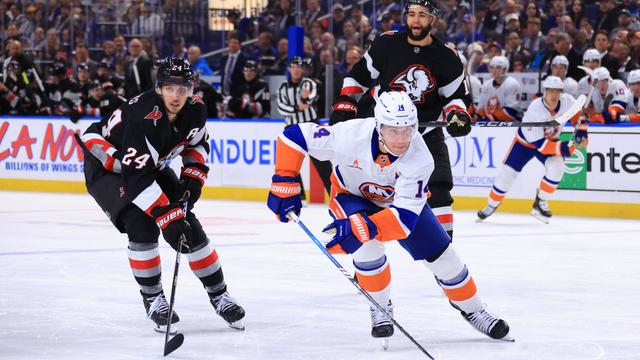 Bo Horvat #14 of the New York Islanders skates against Dylan Cozens #24 of the Buffalo Sabres during an NHL game on November 1, 2024 at KeyBank Center in Buffalo, New York. 