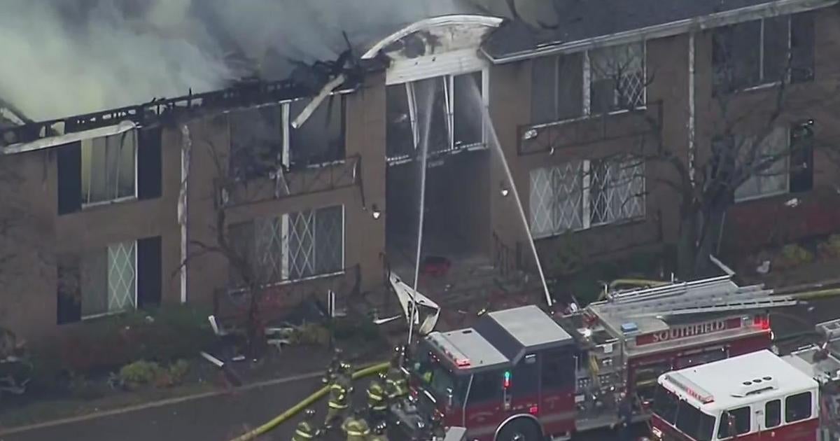 Crews battle large apartment fire in Southfield - CBS Detroit