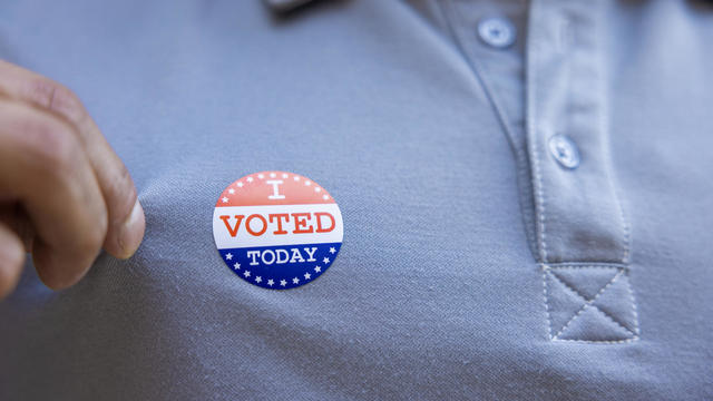 Man with an I VOTED sticker 