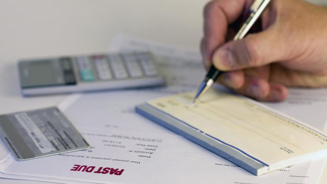 A man writing a check for 