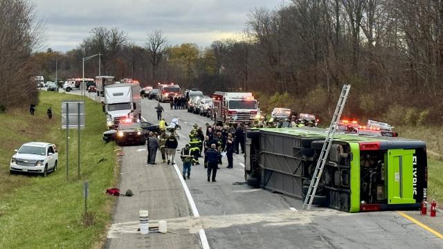 Crews work the scene after a bus overturned on Interstate 490 in Chili, New York, Nov. 7, 2024. 