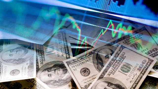 Cash dollar bills and stock market indicators 