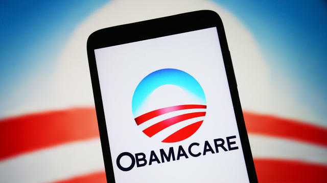 In this photo illustration, Obamacare logo is seen on a 