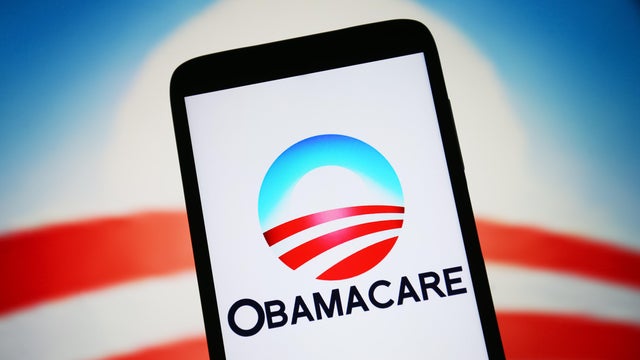 In this photo illustration, Obamacare logo is seen on a