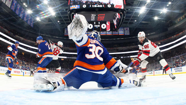 Ilya Sorokin #30 of the New York Islanders makes a save against Jack Hughes #86 of the New Jersey Devils at UBS Arena on November 09, 2024 in Elmont, New York. 