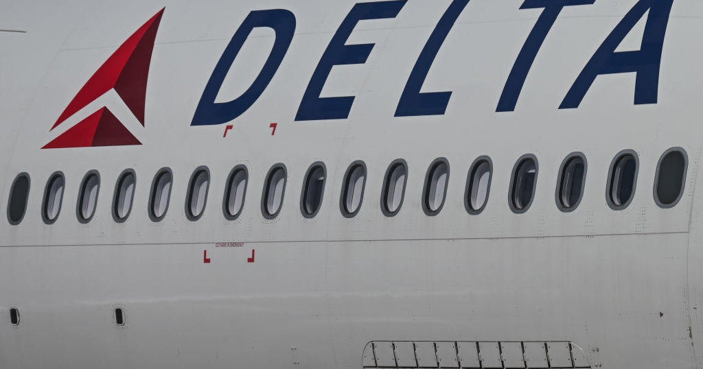 Delta plane clips catering truck while taxiing to gate at Sacramento International Airport