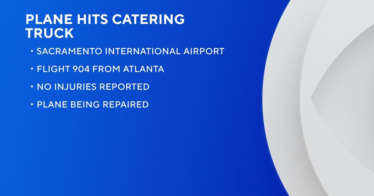 Plane clips catering truck while taxiing to gate at Sacramento airport