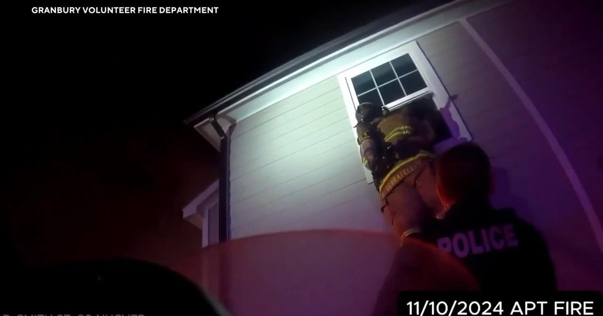 Video shows firefighters rescuing toddler from burning apartment in ...