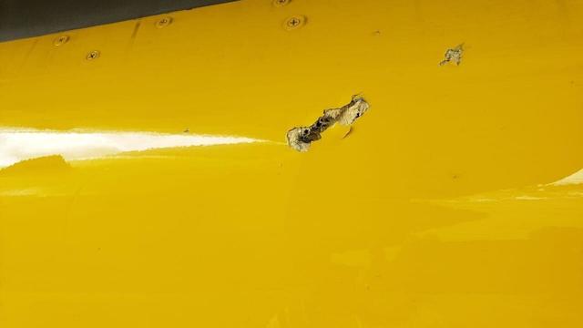 A photo provided by the Dominican Republic's Cibao International Airport shows what looks like a bullet hole in the fuselage of Spirit Airlines Flight 951. 