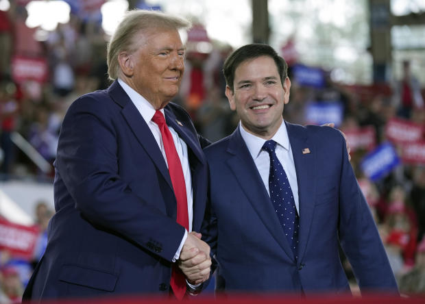 Former President Donald Trump shakes hands with Sen. Marco Rubio 