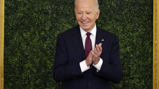 President Biden listens to first lady Jill Biden speak during the Classroom to Career Summit in the East Room of the White House on November 13, 2024 in Washington, DC. 