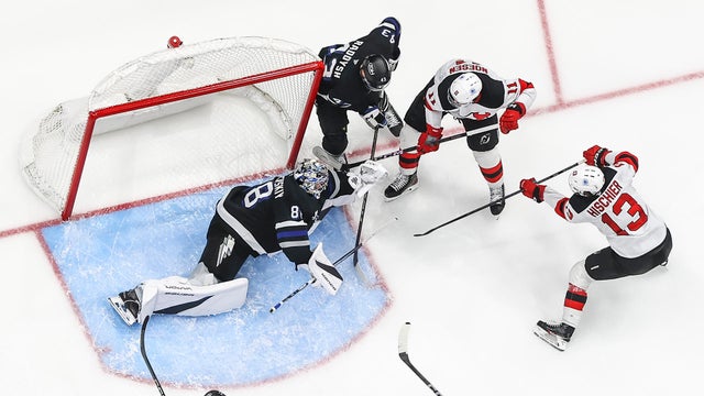 Goalie Andrei Vasilevskiy #88 of the Tampa Bay Lightning makes a save against Nico Hischier #13 of the New Jersey Devils during the second period at Amalie Arena on November 16, 2024 in Tampa, Florida.