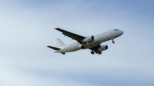 Low angle view of airplane flying against sky,Tallinn Airport,Estonia 