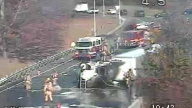 A driver and firefighter were injured after a tractor-trailer overturned, spilling chemicals on I-295, according to the Baltimore County Fire Department. 