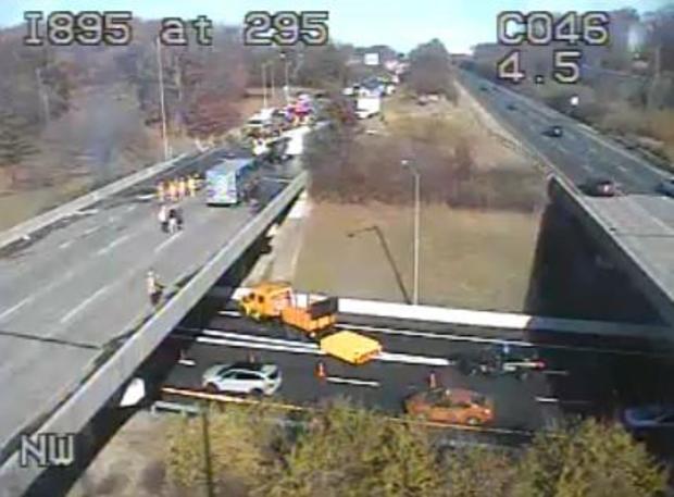 A  driver and firefighter were injured after a tractor-trailer overturned, spilling chemicals on I-295, according to the Baltimore County Fire Department. 