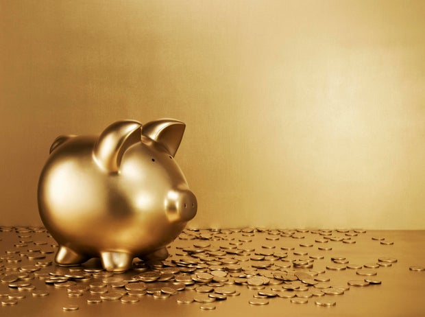 Gold piggy bank with gold coins