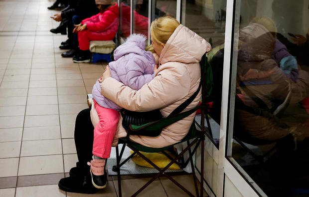 People take shelter inside a metro station during a Russian military attack, in Kyiv 