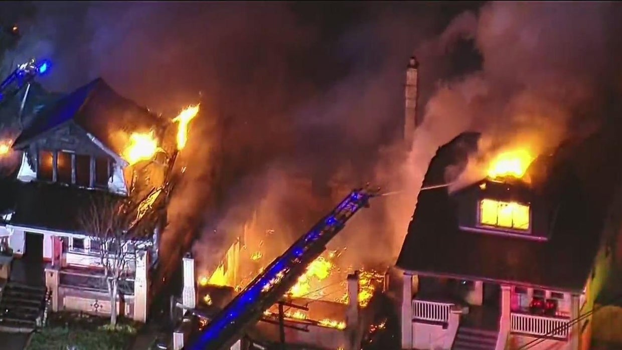 Woman displaced after large fire burns through multiple homes on ...