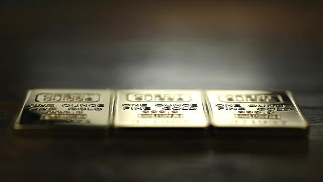 three 1 ounce gold ingots 