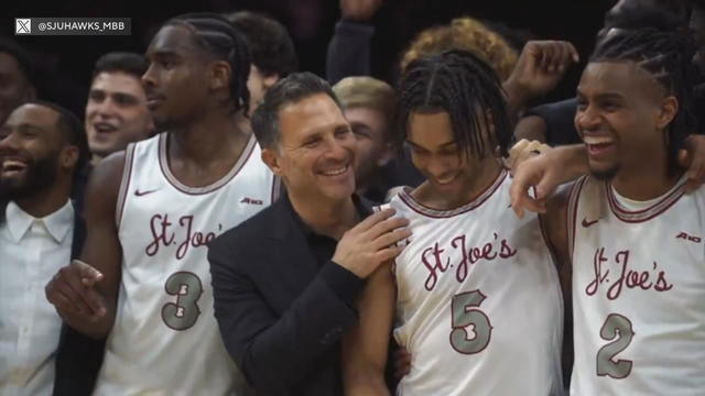 St. Joseph's University basketball team and coach celebrate 