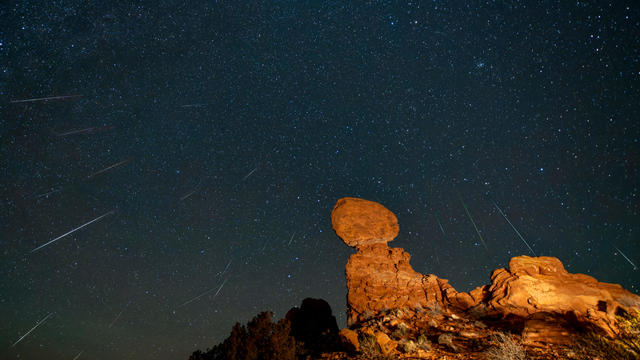 Geminid Meteor Shower over Balanced Rock in Arches National Park in Utah. Composite image shows 24 meteorites over a 2-hour period 