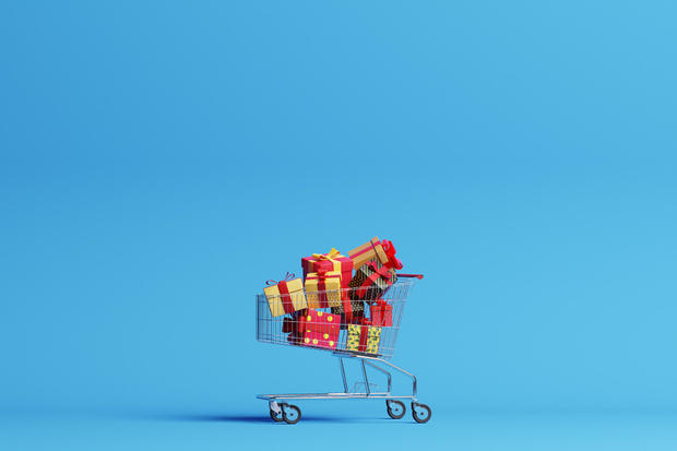 Shopping cart filled with christmas gifts 