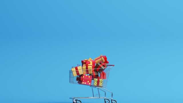 Shopping cart filled with christmas gifts 