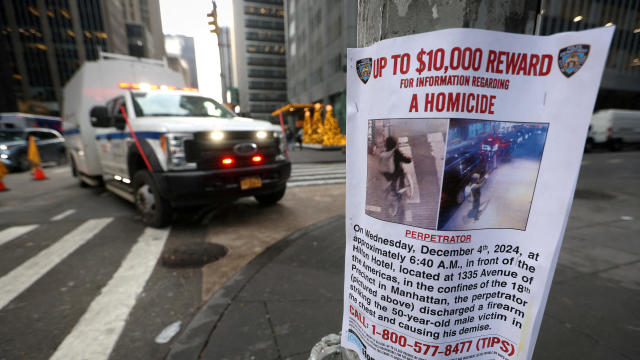 A poster is attached to a lamppost outside the Hilton hotel near the scene where UnitedHealthcare CEO Brian Thompson was shot dead in Midtown Manhattan, in New York City, Dec. 5, 2024. 