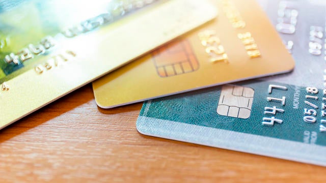 Close up of credit card soft focus and selective focus for background. soft focus close up credit card on wood table background 