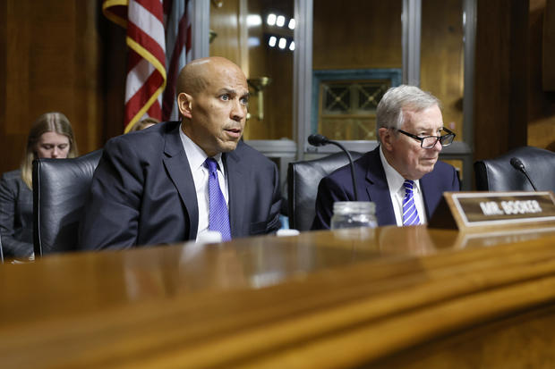 Sen. Cory Booker and Sen. Dick Durbin listen during a hearing with the Senate Judiciary subcommittee on Capitol Hill on June 12, 2024, in Washington, DC. 