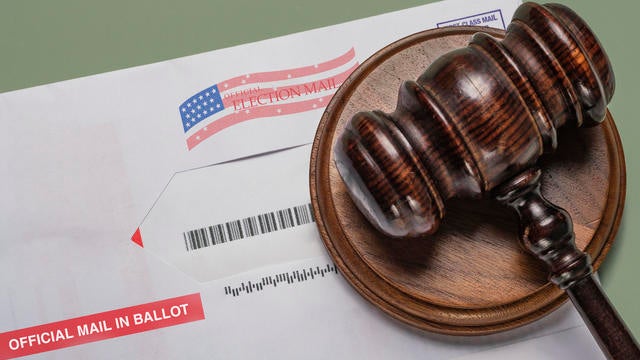 2020 mail in election ballot  with judge's gavel 