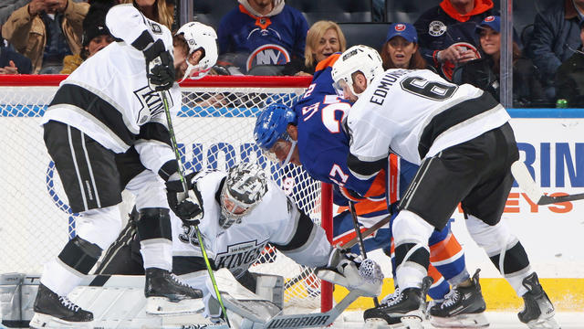 Darcy Kuemper #35 of the Los Angeles Kings makes a third period save on Anders Lee #27 of the New York Islanders at UBS Arena on December 10, 2024 in Elmont, New York. 