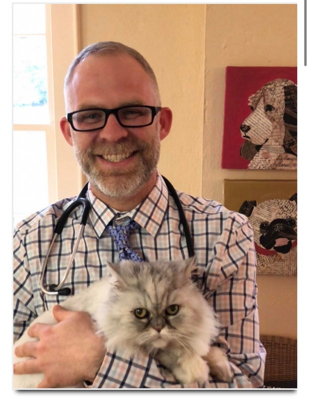 Dr. Michael Anthony holding a cat 