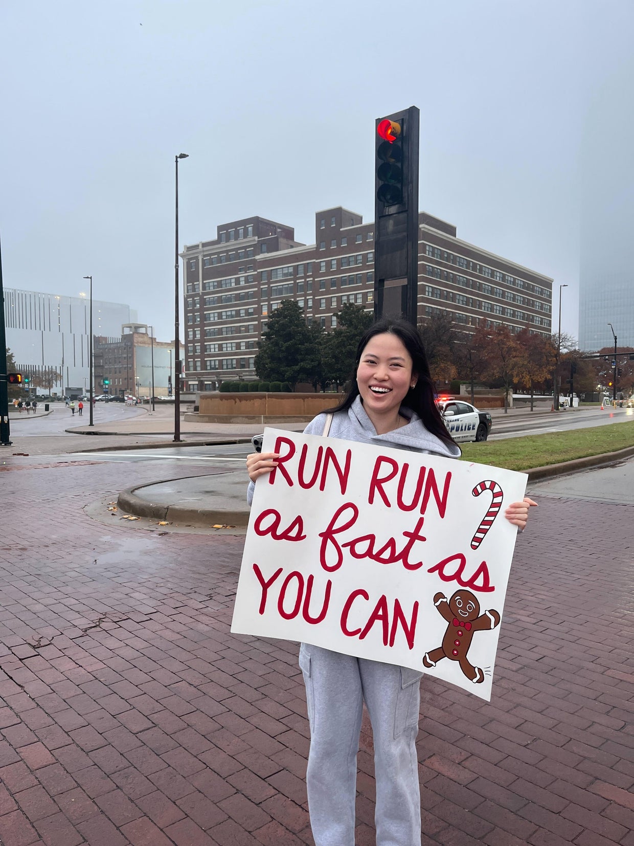 Fans cheer on runners with creative signs at the BMW Dallas Marathon