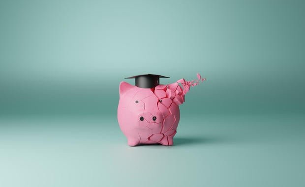 Student loan piggy bank crack concept 