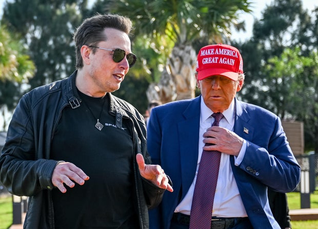 Elon Musk greets President-elect Donald Trump