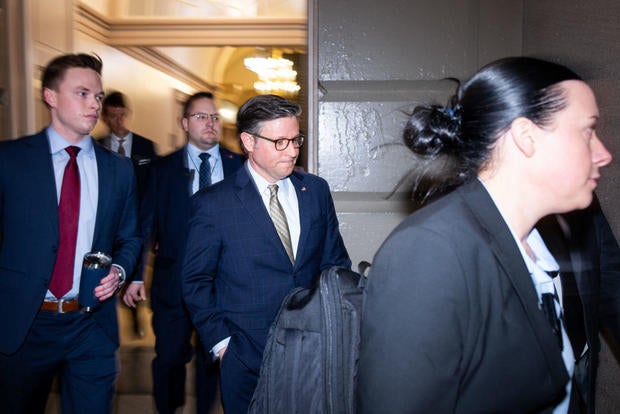 House Speaker Mike Johnson arrives for the House Republican Conference meeting on Friday, Dec. 20, 2024. 