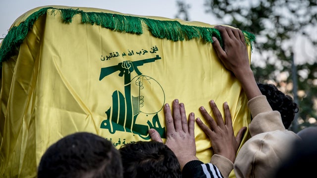 Men carry the coffin of a Hezbollah fighter during a funeral