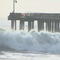 Huge waves tear through Santa Cruz wharf, sending debris into the ocean