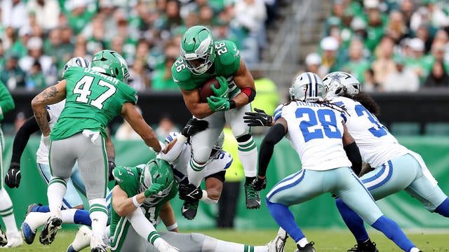 Saquon Barkley carries the ball during a game against the Dallas Cowboys 