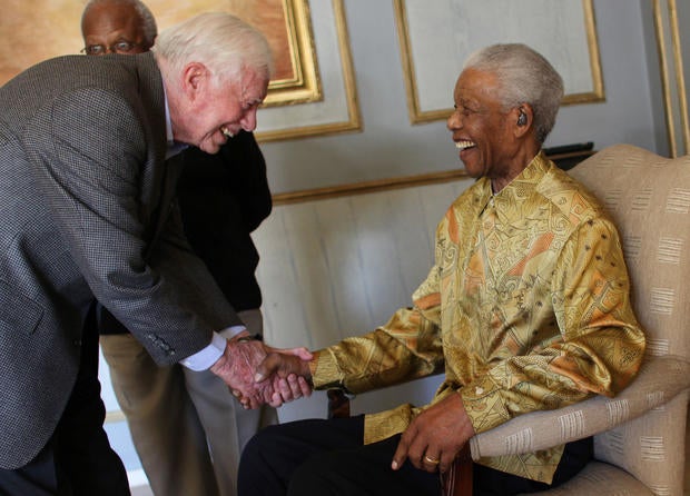 Nelson Mandela greets Jimmy Carter in 2010 