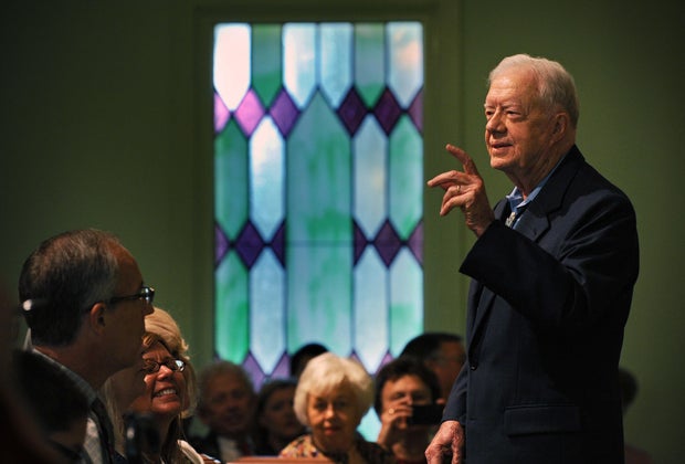 Former President Jimmy Carter greets members and visitors to Maranatha Baptist church in Plains, Georgia.