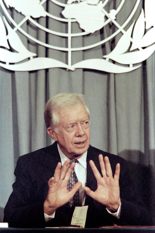 Former U.S. President Jimmy Carter speaks to reporters at the United Nations 